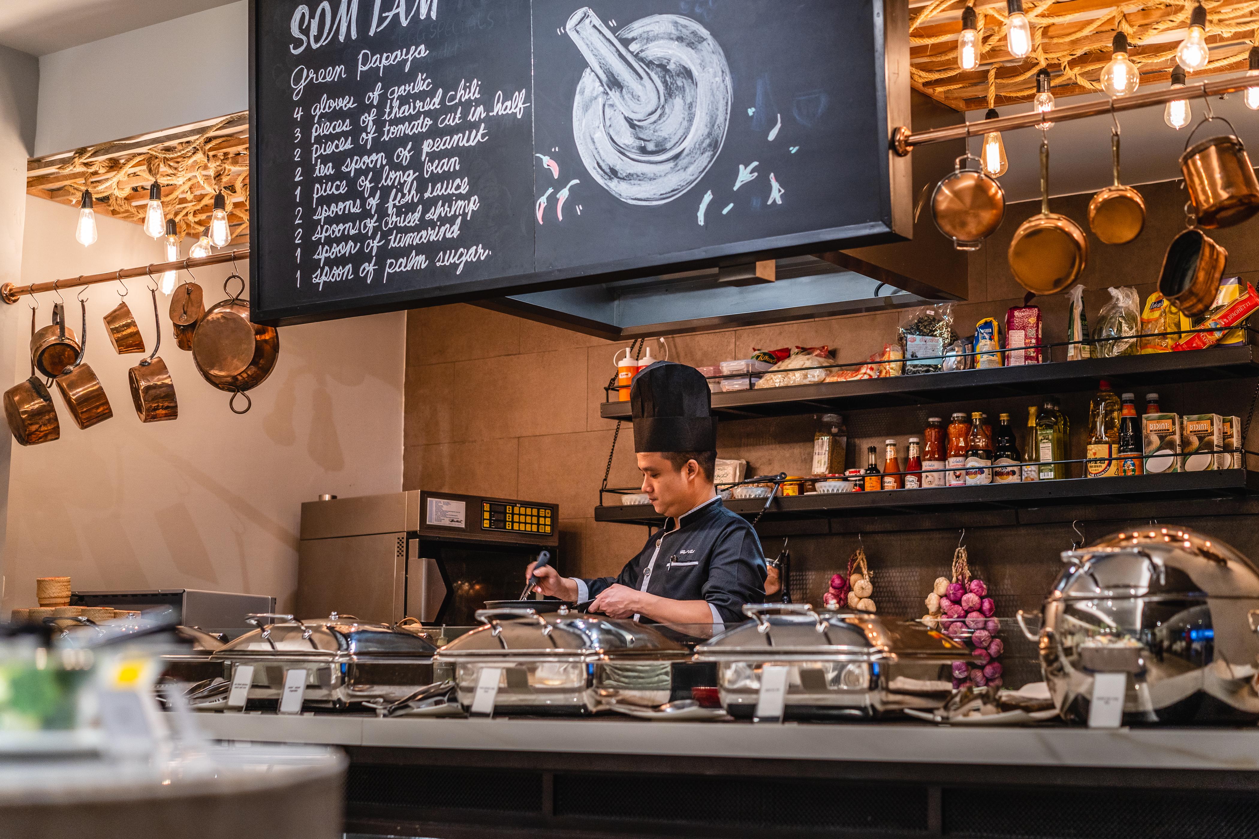 Muu Bangkok, Small Luxury Hotels Of The World Экстерьер фото A chef at work