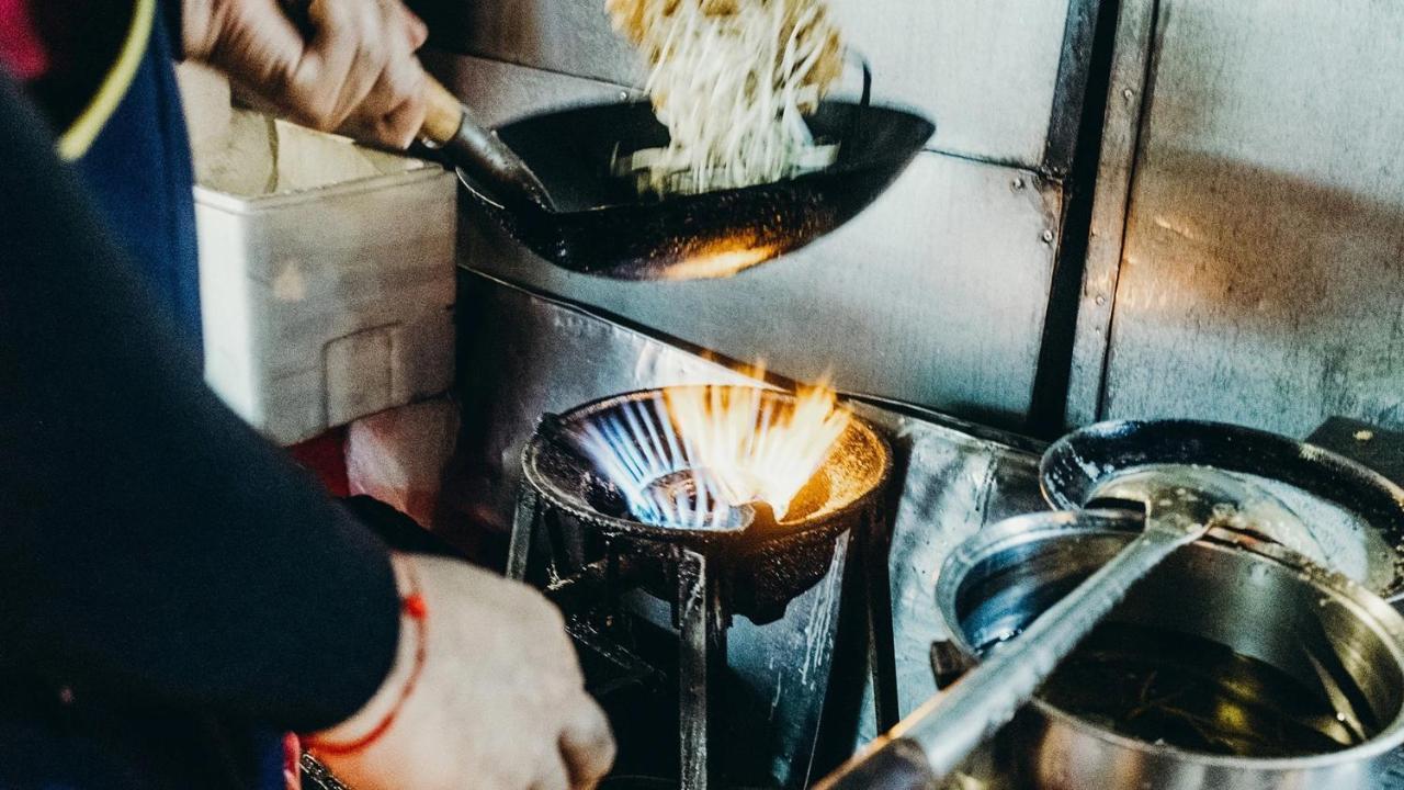 Muu Bangkok, Small Luxury Hotels Of The World Экстерьер фото A wok being used in a restaurant kitchen