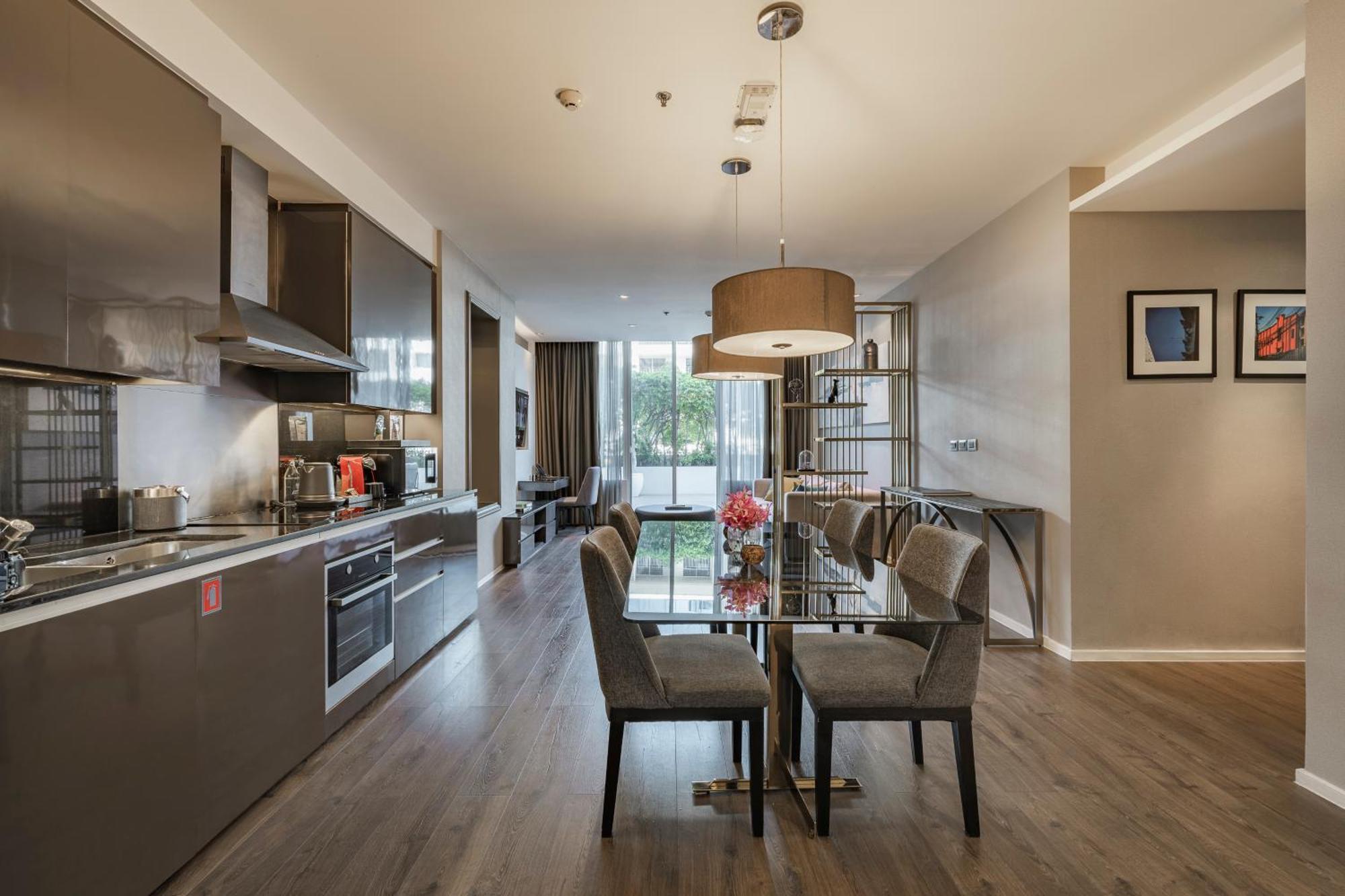 Muu Bangkok, Small Luxury Hotels Of The World Экстерьер фото The kitchen and dining area of a typical apartment